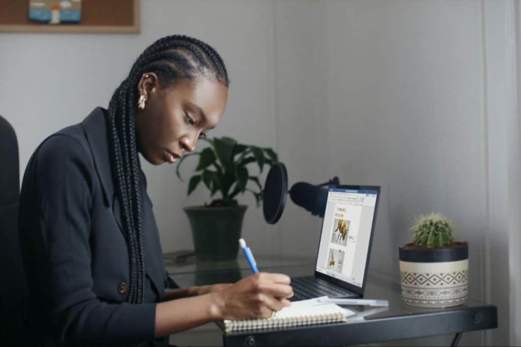 Woman writing on her notebook