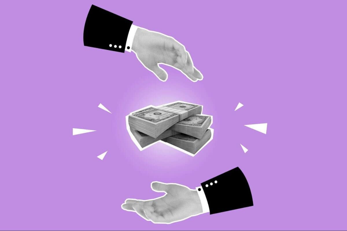 Hands controlling a stack of money in the air