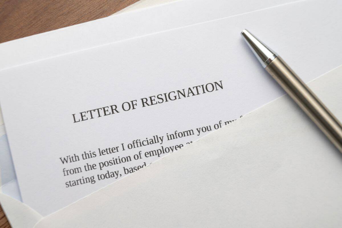 Employee resignation letter and pen beside
