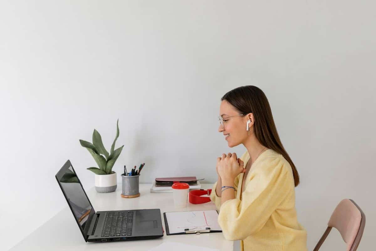 Freelancer in a yellow shirt working remotely