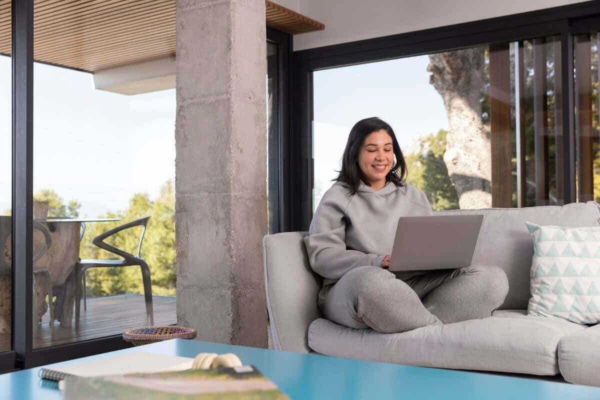 Woman at home using laptop