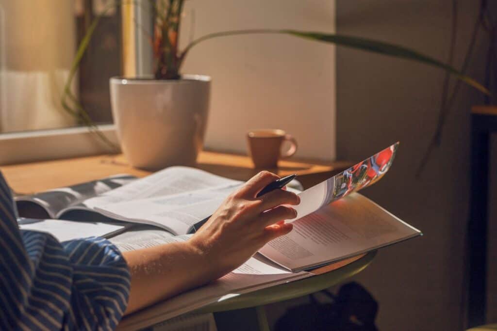 Closeup woman reading books 