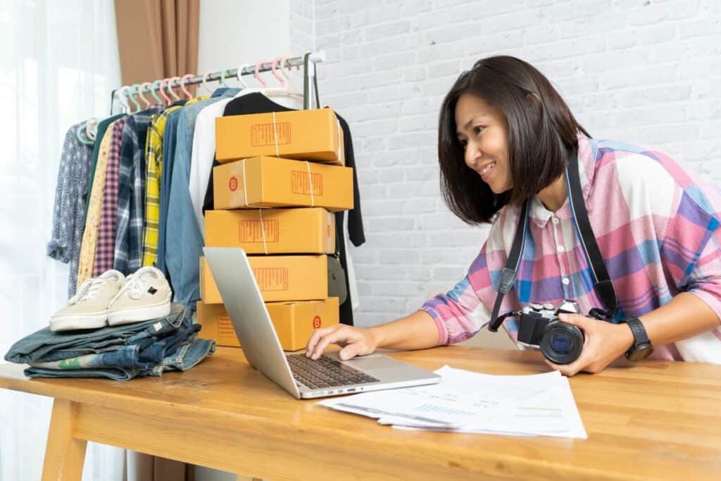 Asian women working laptop computer selling online