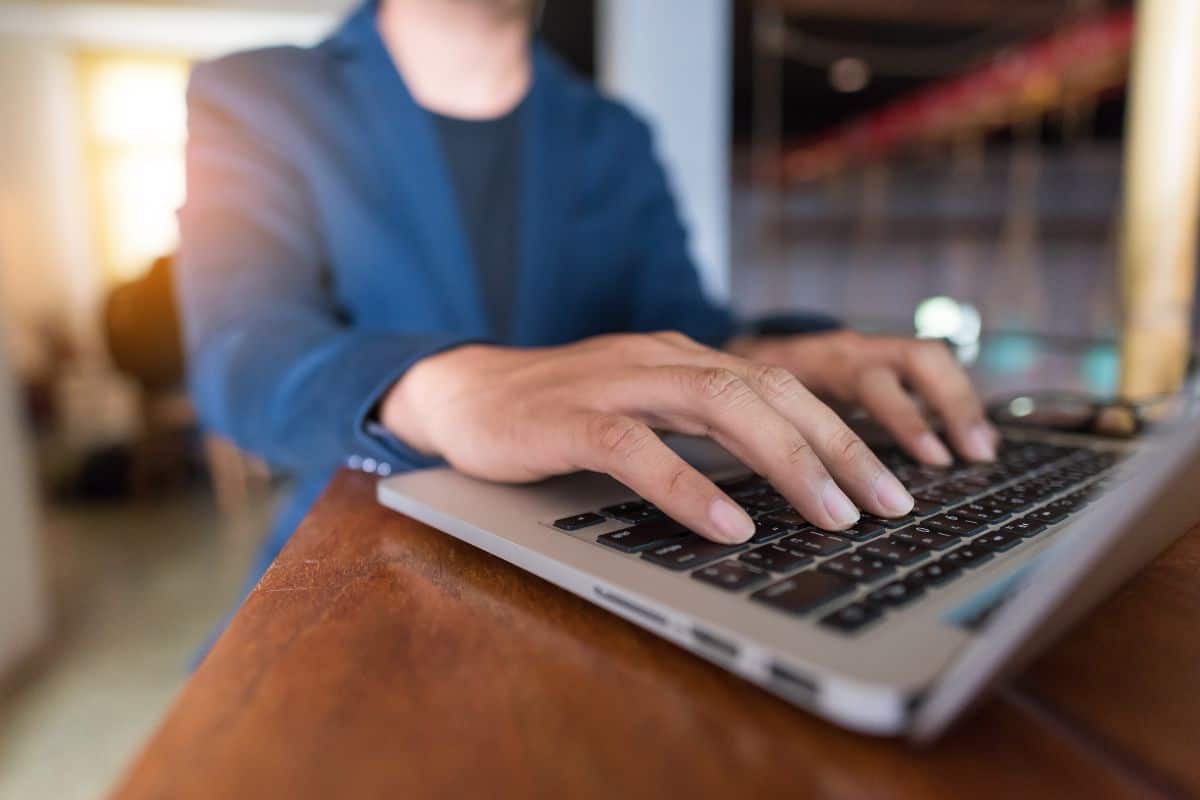 Asian business man working with laptop in coffeeshop