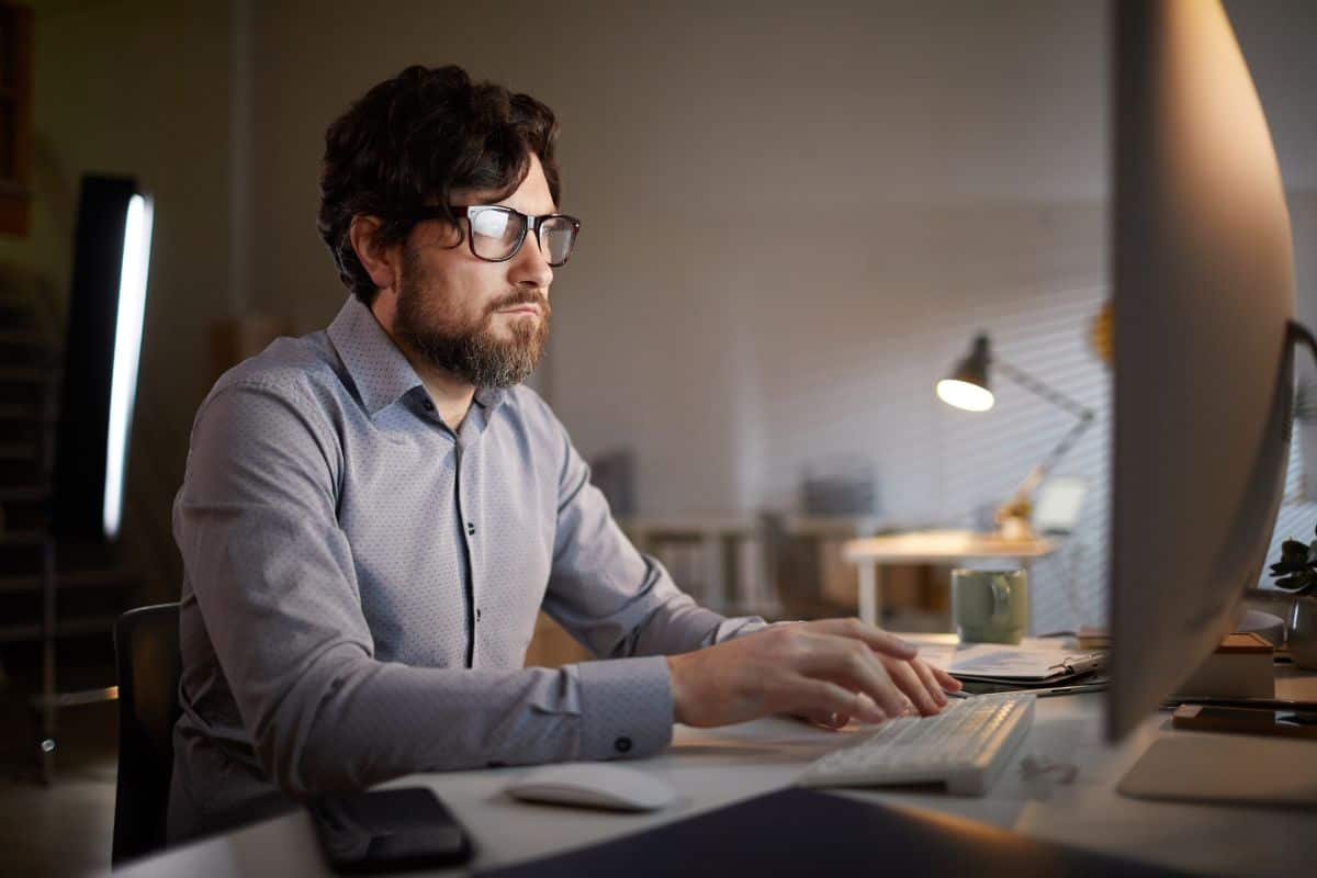 Man working on computer at office