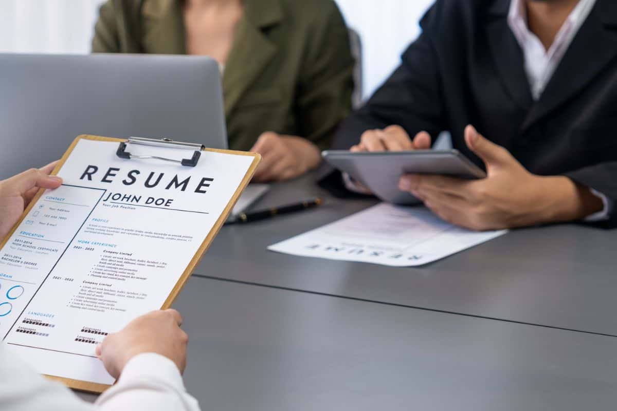 Candidate and interviewers discuss work experience in job interview
