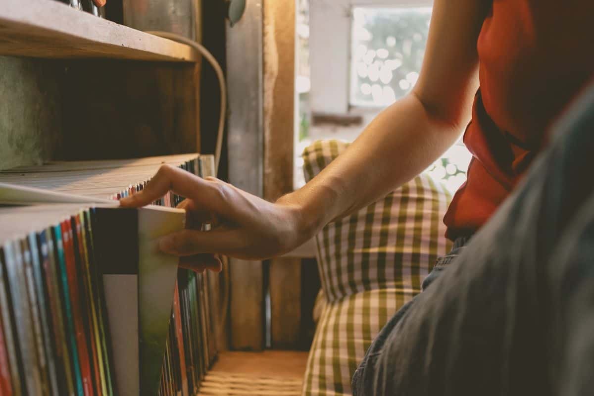 Part of woman in her library room in a casual day