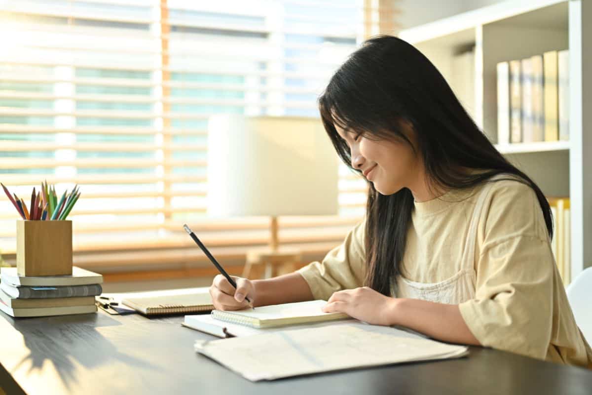 Image of smiling asian teenage student