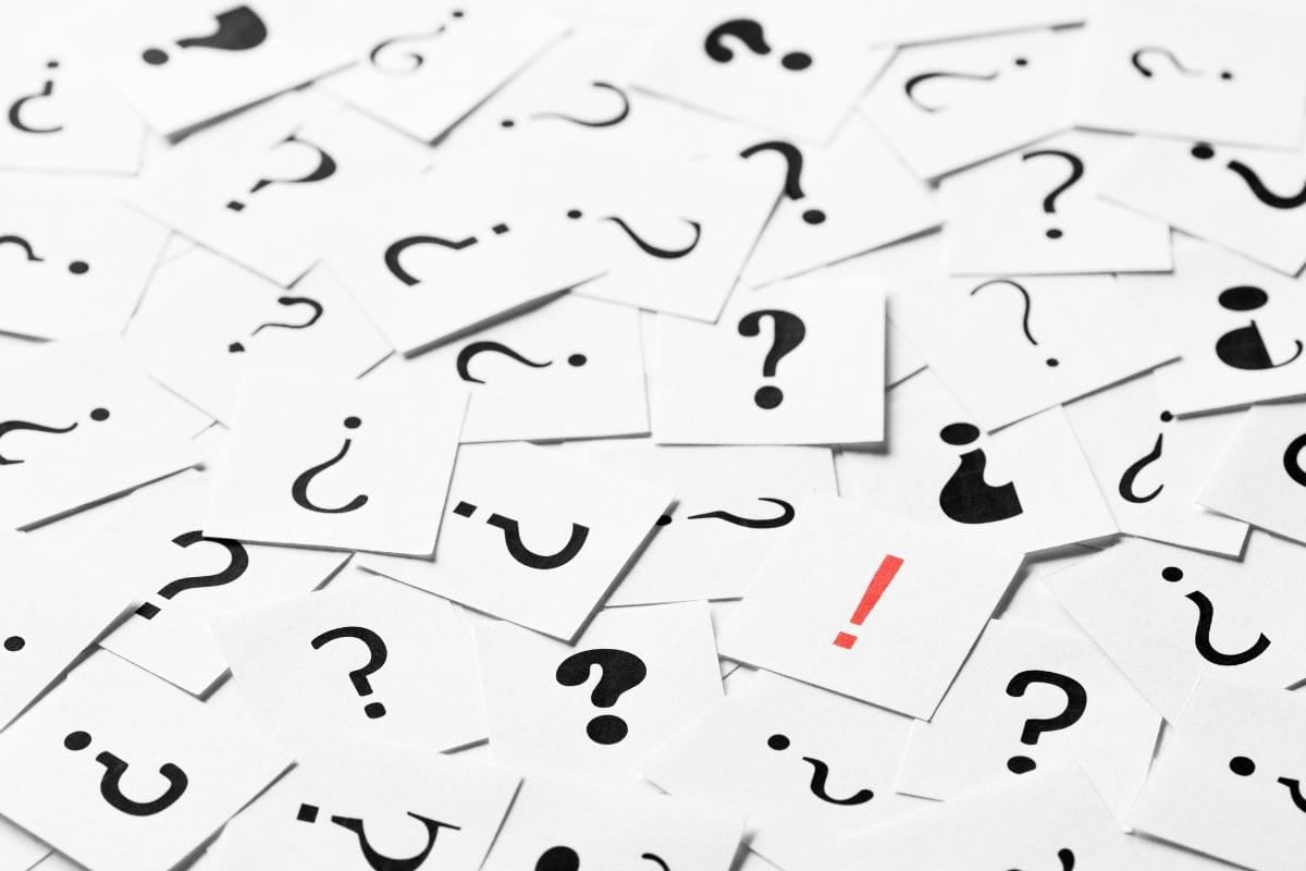 Pile of question mark signs scattered around