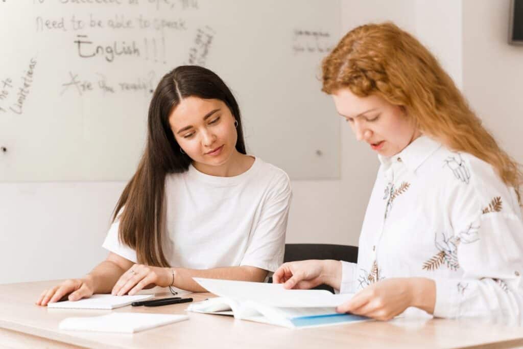 Teacher of english asks student in white class