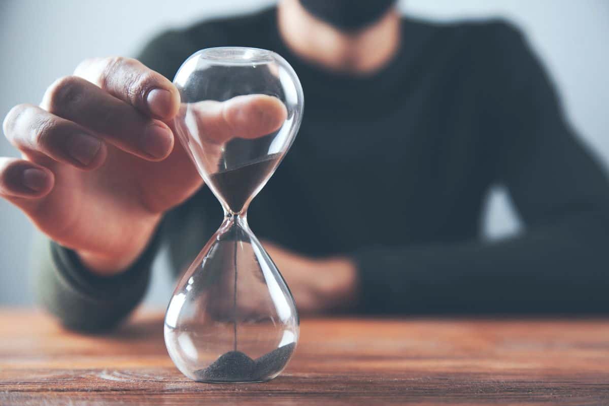 Man hand sand clock