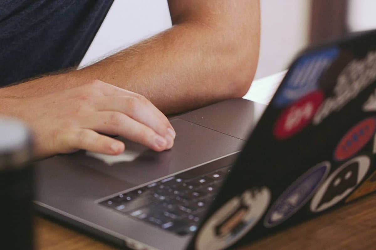person using black laptop computer