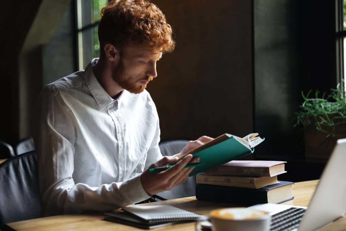 Photo of concentrated redhead bearded student