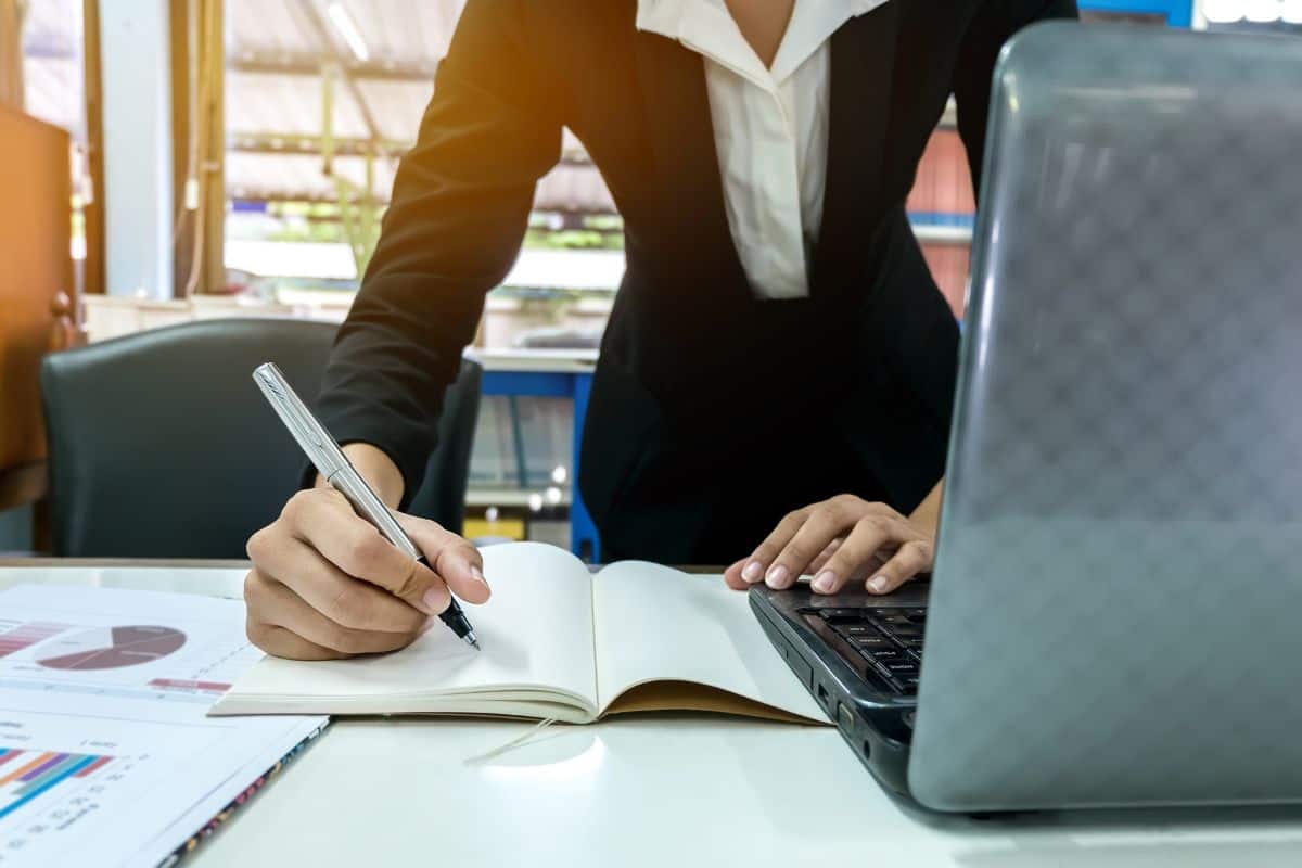 Midsection of woman working on table