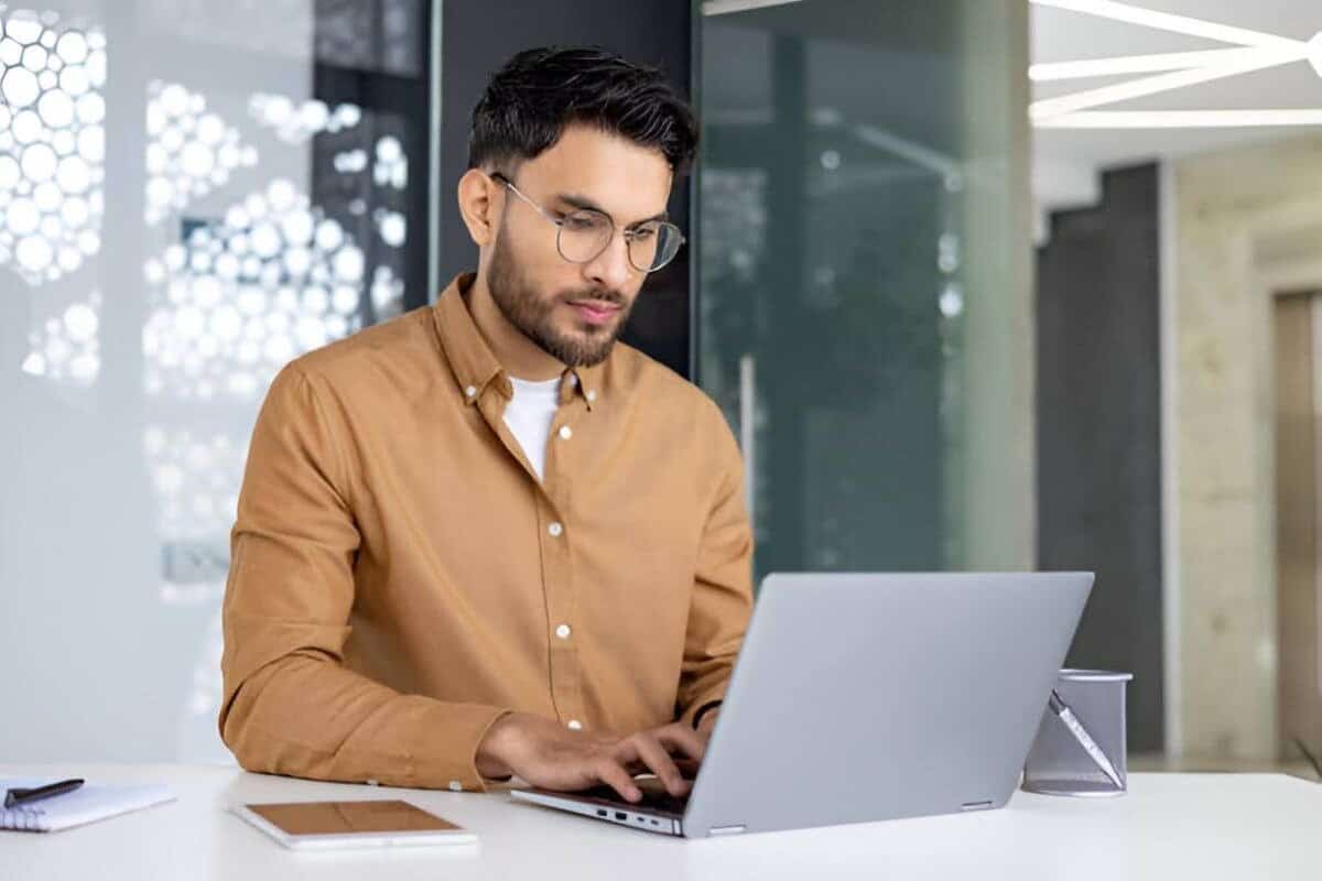 Man working on his laptop at a desk