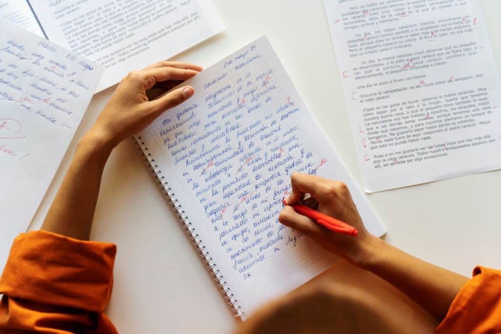 Top view adult correcting grammar mistakes
