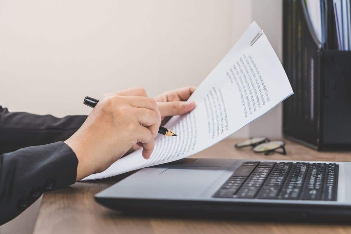 Business woman checking the paper