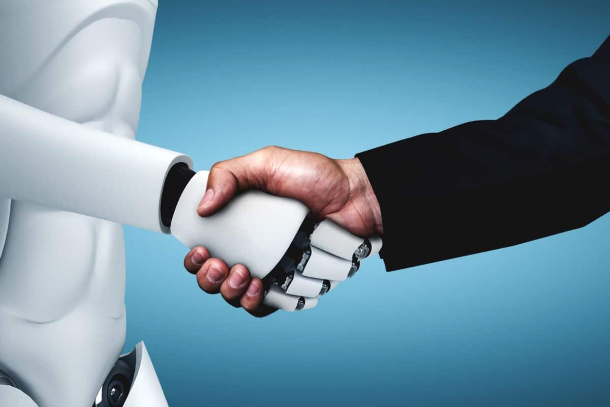 Como fazer uma pergunta à IA: Obtenha respostas precisas rapidamente 6 Humanoid robot shaking hands with a man