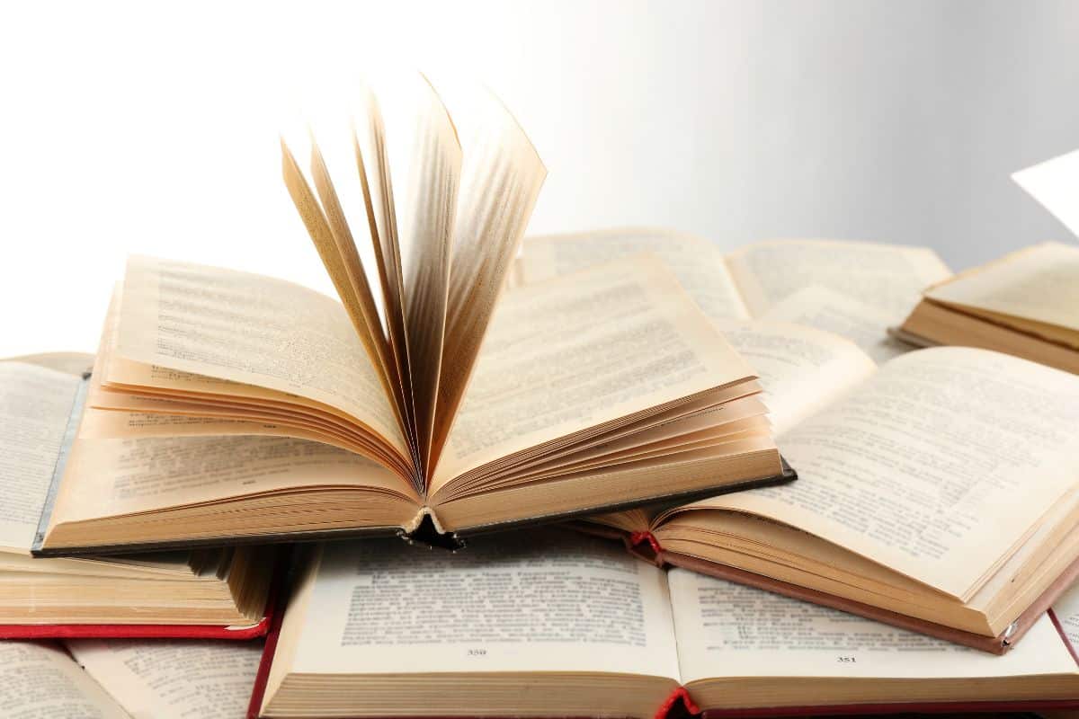 Many open books isolated on white