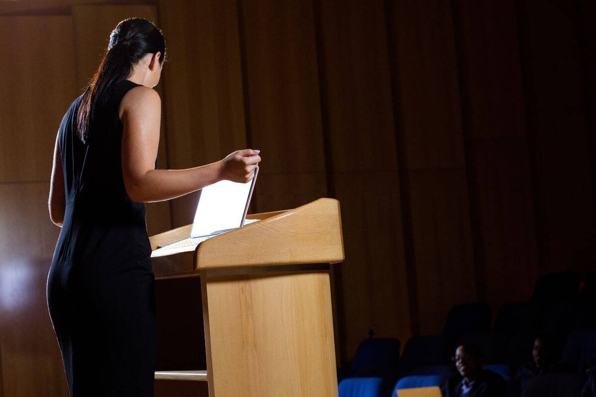 Female business executive giving a speech