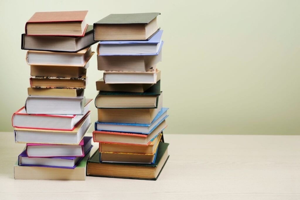 Stacked books of different colors and sizes