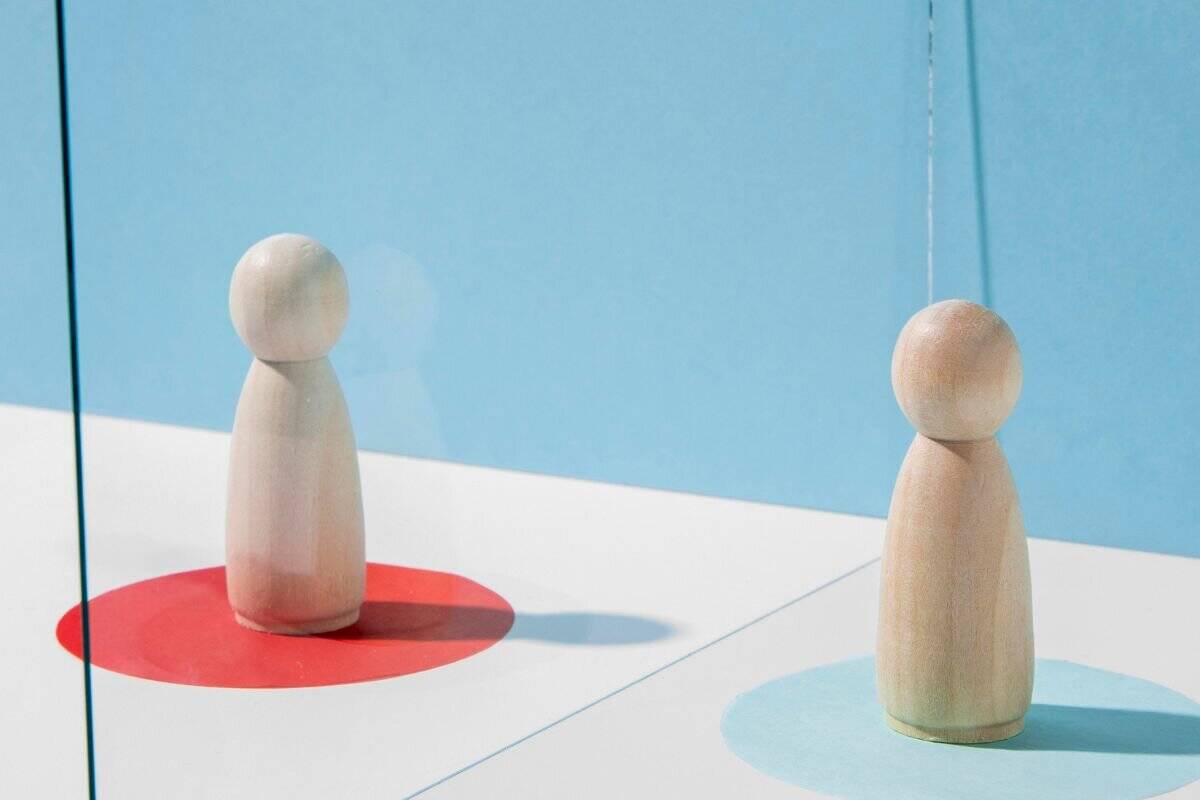 Wooden pawns with glass divider for coronavirus safety