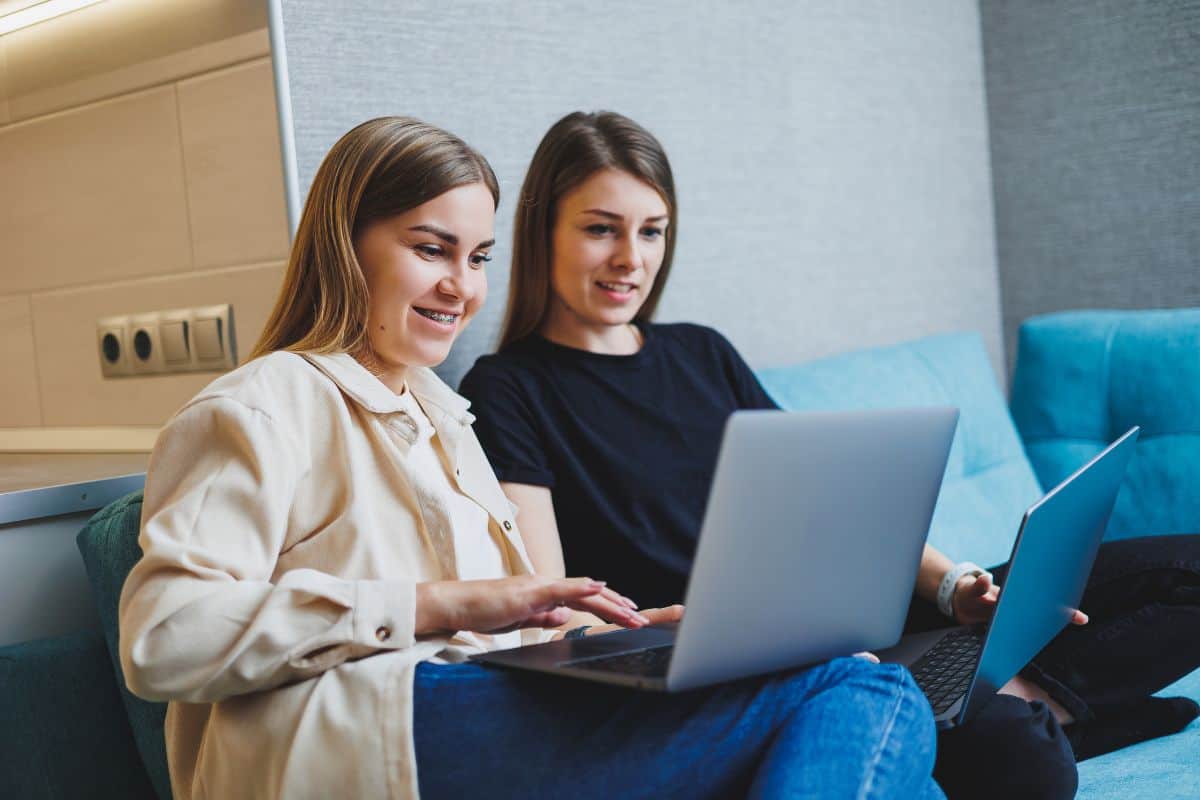 Two cute women are chatting with their friends