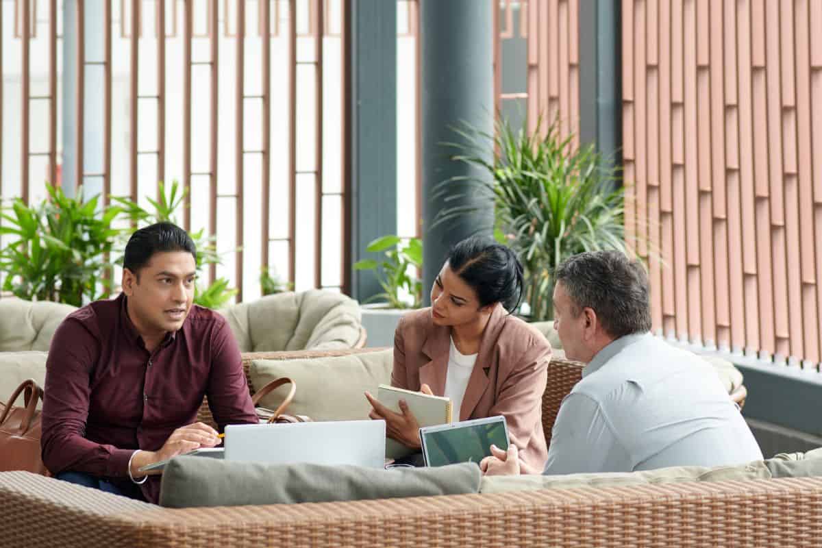 Business team gathered at business center lounge