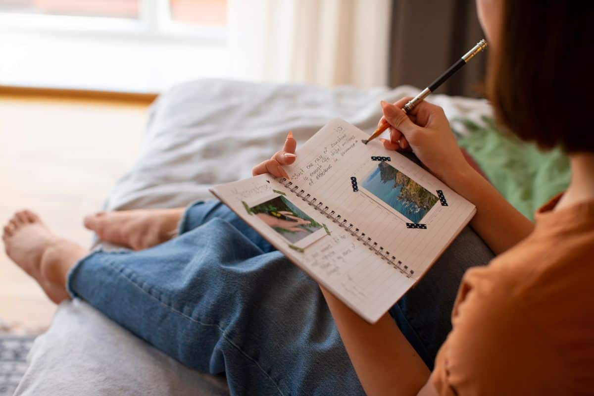 Side view woman doing creative journaling