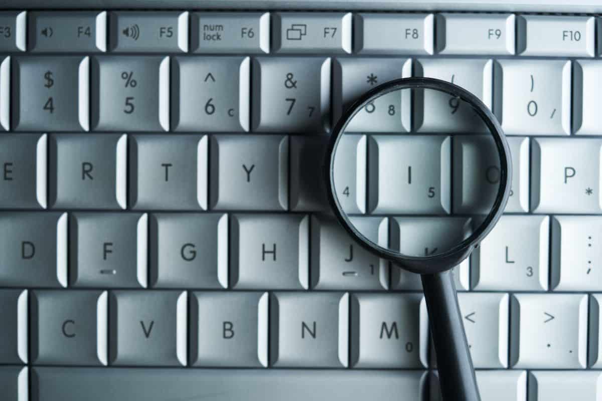 Magnifying glass on computer keyboard