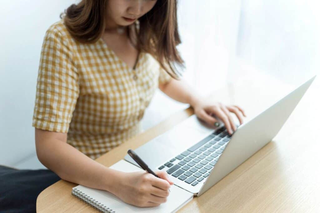 Entrepreneur concept a young female entrepreneur doing notetaking