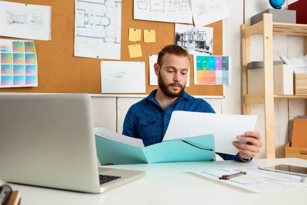 Successful businessman looking through papers