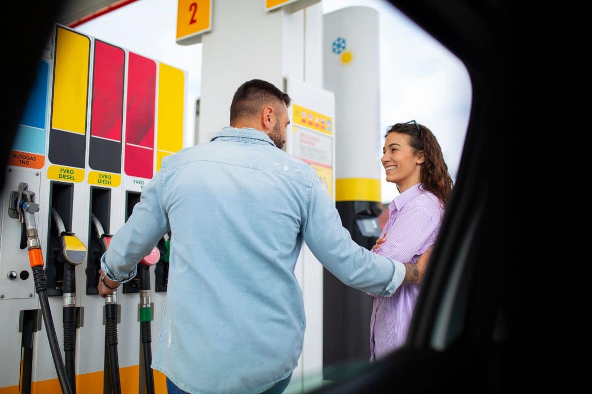 People spending time at the gas station