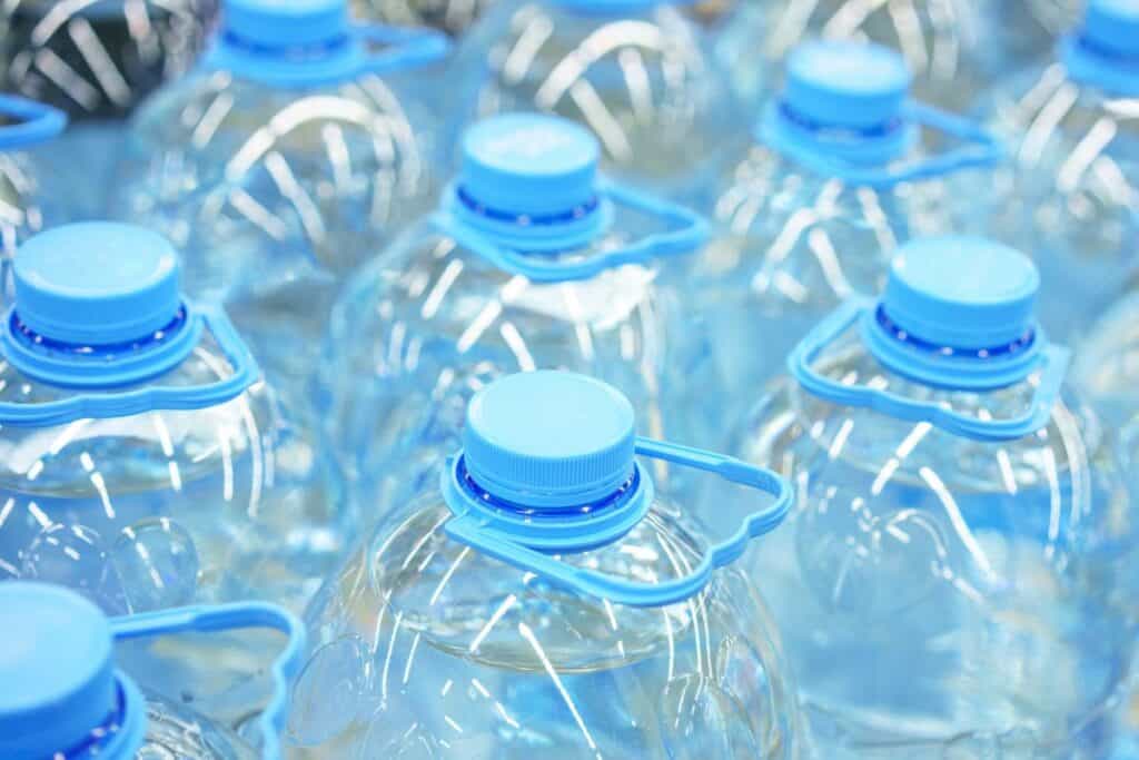 Five-liter plastic drinking water bottles close-up