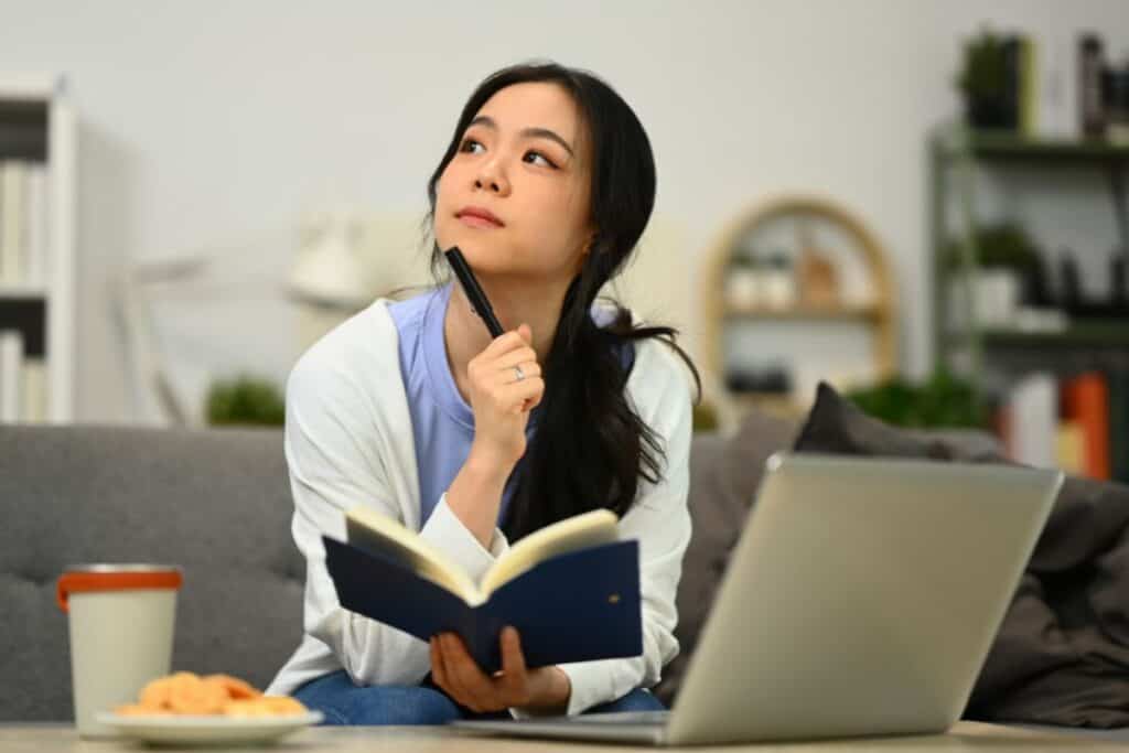 Thoughtful young female freelancer