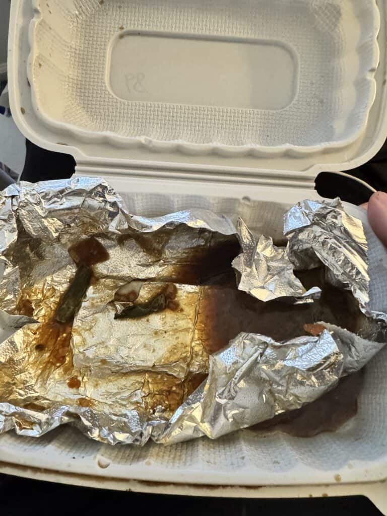 A photo of an empty food takeout box.